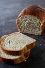 Matcha tea bread loaf on a dark background