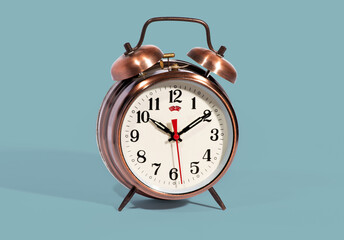 Vintage style alarm clock with bells on blue background