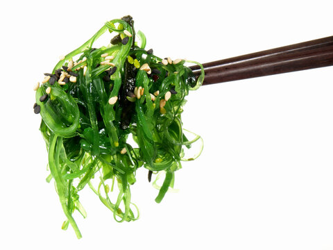 Seaweed Salad with Chopsticks - Healthy Nutrition on white Background - Isolated