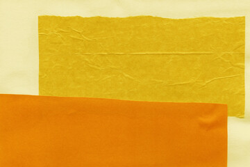 Colorful torn paper collage close-up. Texture made from various paper and cardboard parts. Damaged old paper background. Vintage blank wallpaper. Material design backdrop.