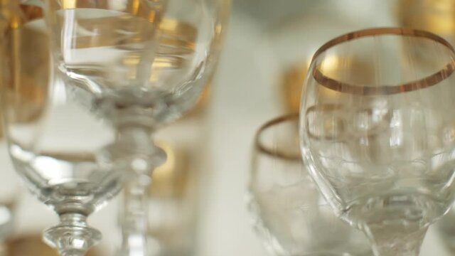 Many glass bocal crockery decorated with different ornaments tracking shot