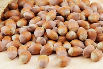 Hazelnuts whole nuts on wooden background