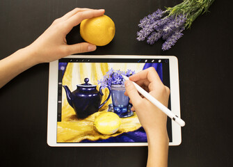 A girl's hand draws a still life picture with a pencil on an electronic tablet. The concept of inspiration, creativity, self-development, hobby, modern art