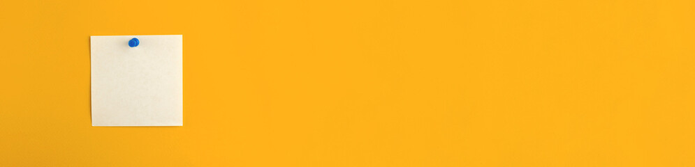 Banner with pinned notepad white sheet of paper on a yellow wall, isolated, mockup and template for...