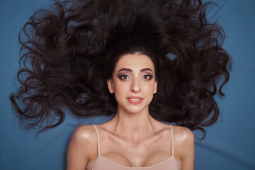 Skin care beautiful cosmetic makeup mixed race brunette model with gorgeous hair headshot full lips...