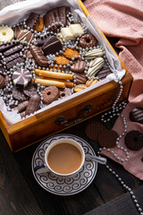 A treasure chest of chocolate treat cookies for sharing at teatime. Dark brown and pink