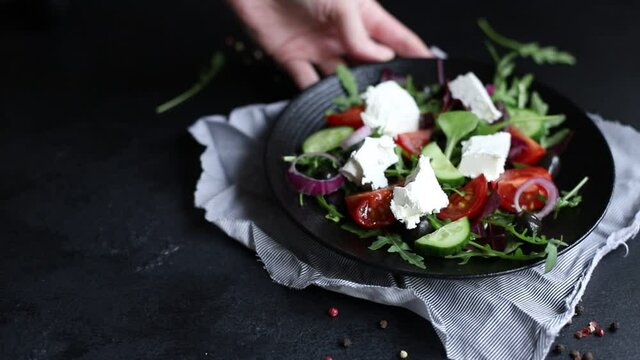 Greek salad vegetables and feta cheese ready to eat portion on the table for healthy meal snack outdoor top view copy space for text food background rustic image keto or paleo diet