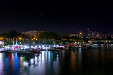 Fototapeta premium Pleasure Ships at the Night Embankment of the Seine
