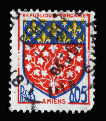 Stamp printed in the France shows Coat of arms of Amiens, circa 1962.