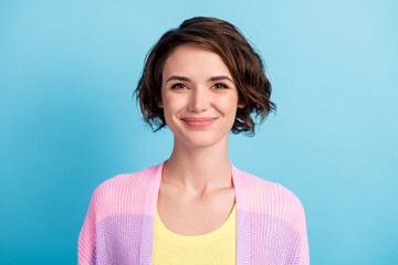 Close-up portrait of attractive cheerful brown-haired girl wearing knitwear isolated over bright...