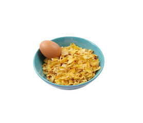 Original taste cereals or cornflakes with boiled egg in blue ceramic bowl isolated on white background with clipping path. The morning food for breakfast concept.