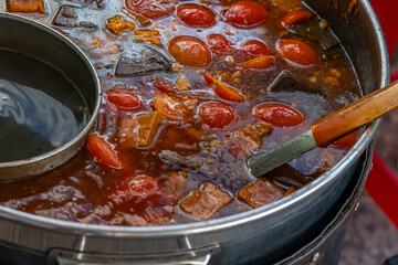 Close up photo of Bun Rieu soup at street food vendor