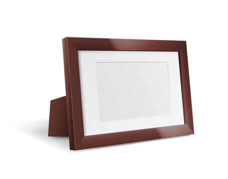 Wooden photo frame standing over white background. Realistic frame for picture