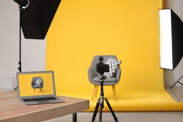Interior of modern studio during photographing of furniture