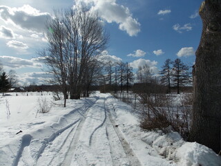 rural landscape in winter blue sky wooden houses