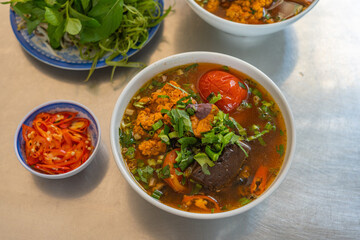 Delicious spicy crab and snail noodle, Bun Rieu - Vietnamese cuisine