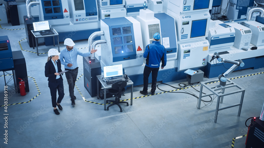 Poster industry four factory: female executive and chief engineer inspect facility workshop, look at robot 