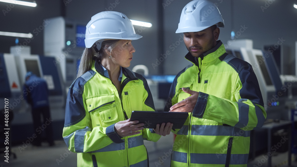 Fototapete chief engineer and project manager wearing safety vests and hard hats, use digital tablet computer i