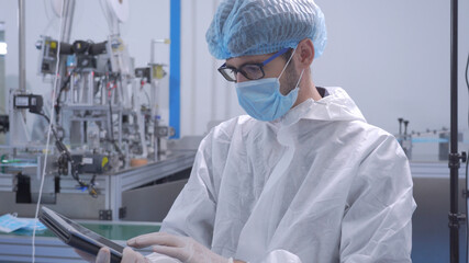 The engineer worker in Automated manufacturing Medical mask prevention Coronavirus