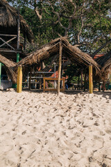 
house made of wooden sticks on the island of baru in cartagena