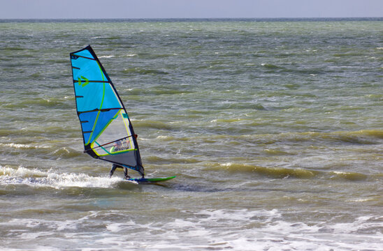 Windsurfer in the Gulf of Morbihan during a rainy afternoon at Penviens Sarzeau.