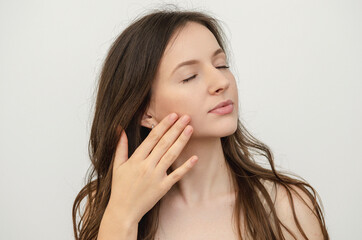 portrait of a woman touching her face