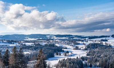 Fototapeta premium winter landscape in the lower western Allgaeu Alps with the village of Oberreute