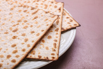 Plate with Jewish flatbread matza for Passover on color background, closeup
