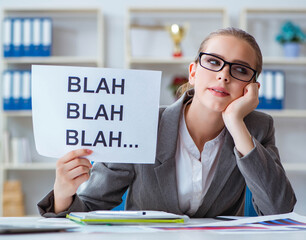 Businesswoman sitting in office with message