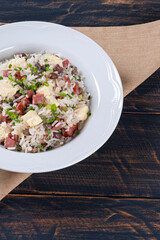 .Brazilian food called Baião de Dois. Very common in the north of the country. Made with rice, beans, sausage and rennet cheese.