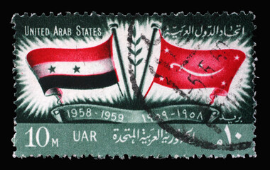 Stamp printed in Egypt shows Flags of U.A.R. and Yemen, 1st Anniversary of Proclamation of United Arab States, circa 1959
