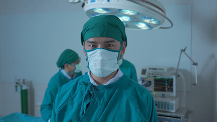 Fototapeta na wymiar Portrait of a surgeon in front of the operation room