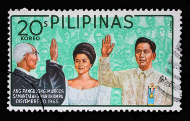 Stamp printed in Philippines shows Ferdinand Marcos Inauguration, circa 1966 - obrazy, fototapety, plakaty