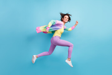 Fototapeta na wymiar Photo portrait full body side view of running girl isolated on pastel blue colored background