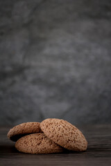 a stack of oatmeal cookies on a wooden table