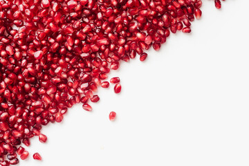 pomegranate seeds on white background, color background