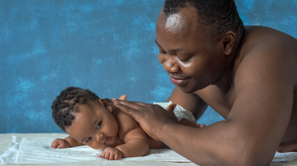 African man with his little baby