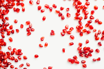 pomegranate seeds on white background, color background