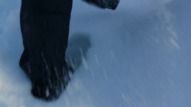 First person of someone walking through the snow