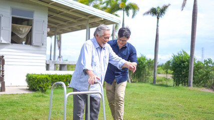 Senior asian man struggling to us a walker