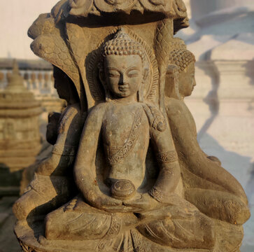 buddha statue in the temple, stone carving, stone buddha statue in Nepal temple.