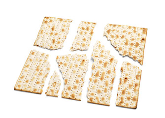 Broken Jewish flatbread matza for Passover on white background