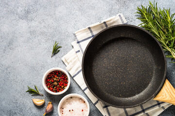 Food background. Kitchen table with herbs, spices and olive oil. Top view with copy space.