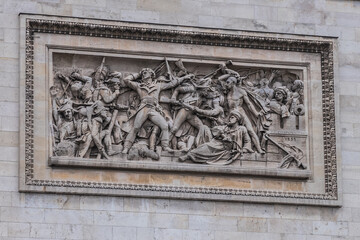 Architectural fragment of Arc de Triomphe. Arc de Triomphe de l'Etoile on Charles de Gaulle Place is one of the most famous monuments in Paris. France.