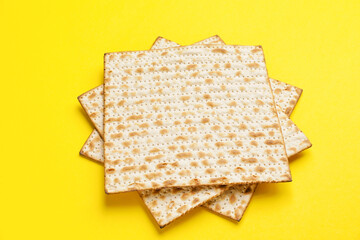 Jewish flatbread matza for Passover on color background