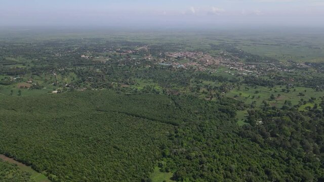 The Lush Green Island In Kilimanjaro Kenya With A Foggy Environment - Aerial Shot