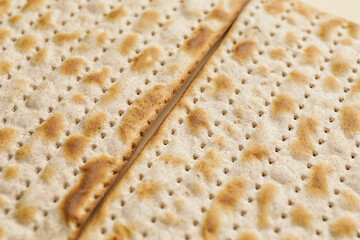 Jewish flatbread matza for Passover as background, closeup