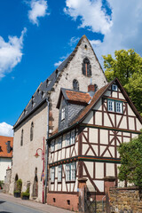Obraz premium View of a typical historic half-timbered house in Butzbach / Germany in the Taunus mountains with glorious sunshine
