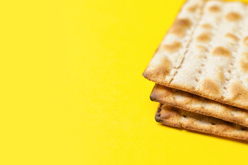 Jewish flatbread matza for Passover on color background
