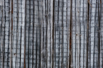 facade of an old wooden house on which an interesting pattern of plaster in the fixtures is formed